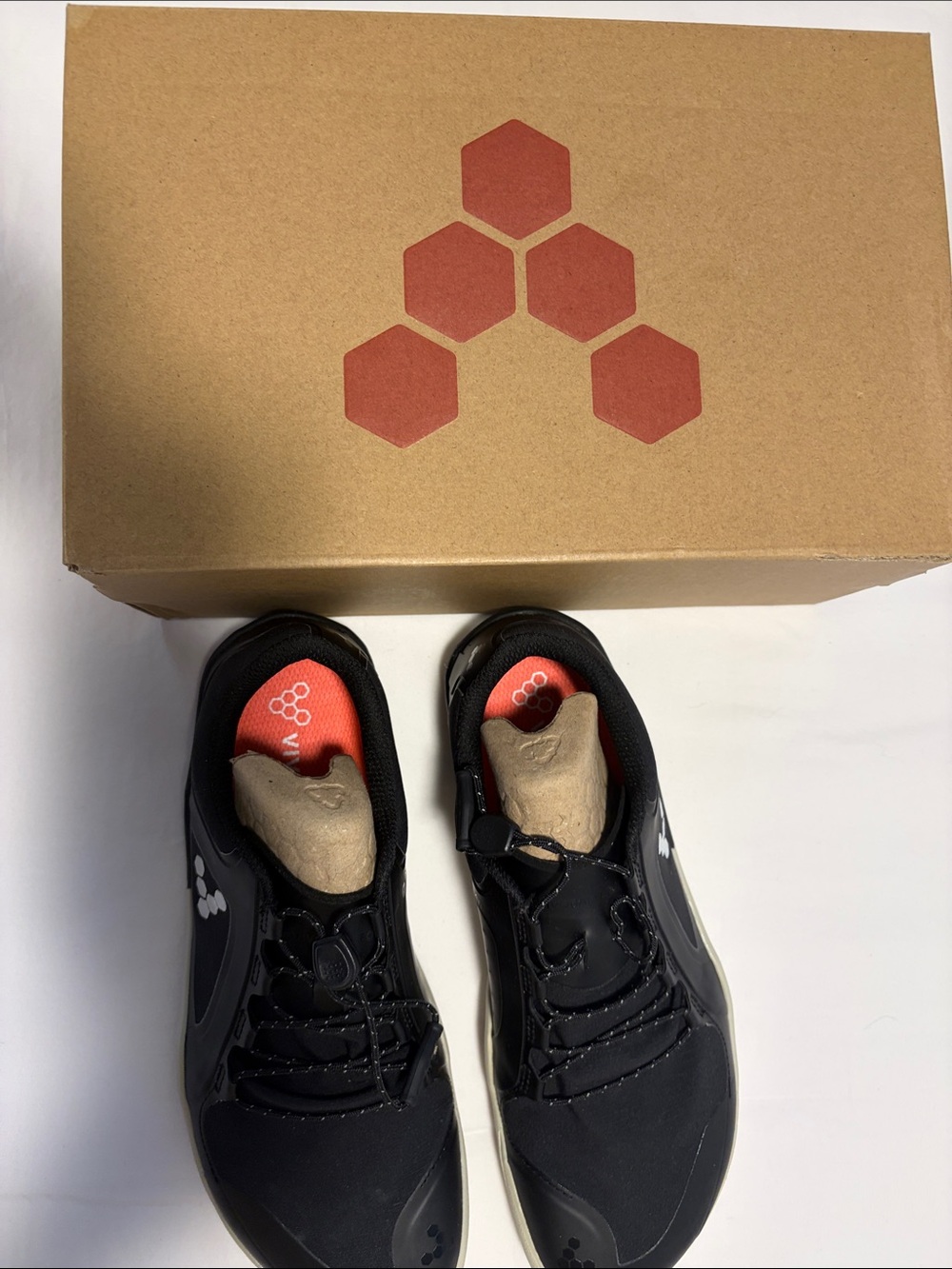 Vivo Barefoot black sneakers with tan accents